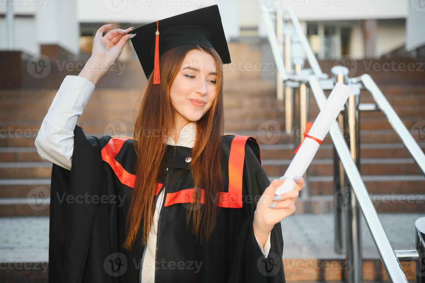 Woman portrait on her graduation day. University. Education, graduation and people concept. photo