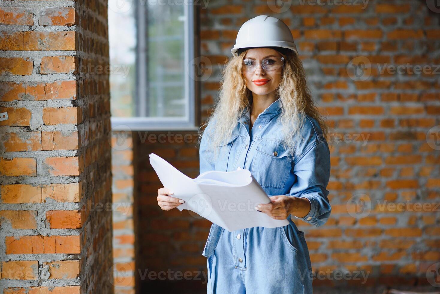 Warehouse woman worker. Woman builder in hardhat. Girl engineer or architect. Home renovation. Quality inspector. Construction job occupation. Construction worker. Lady at construction site photo