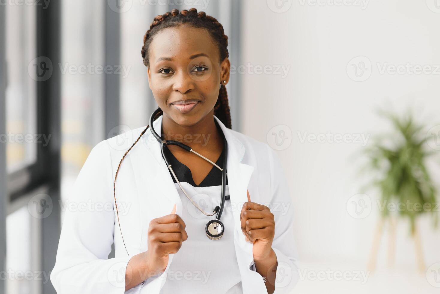 portrait of african female doctor at workplace. photo