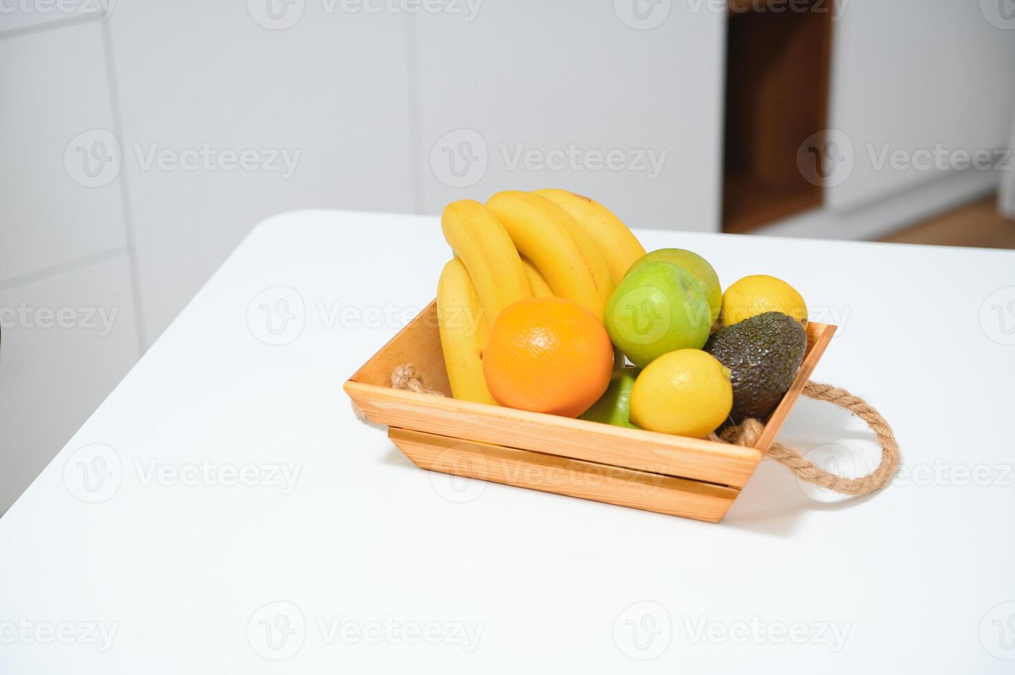 handmade kraft box with fruits and vegetables on kitchen background. photo