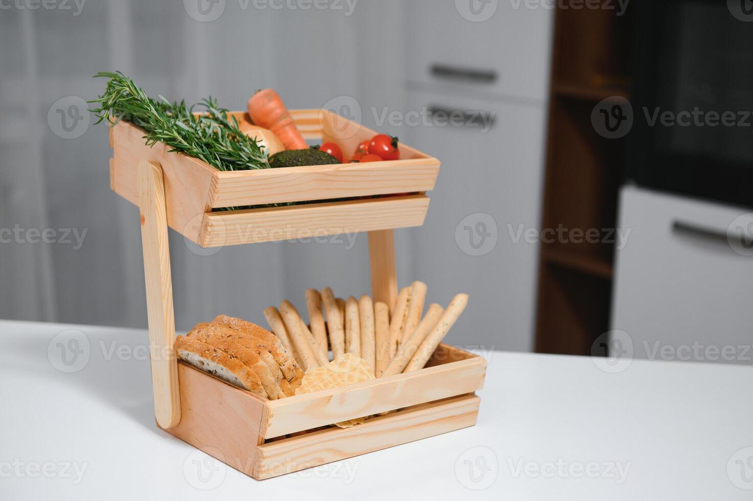 Craft wooden plate for storing bread or vegetables in the kitchen photo