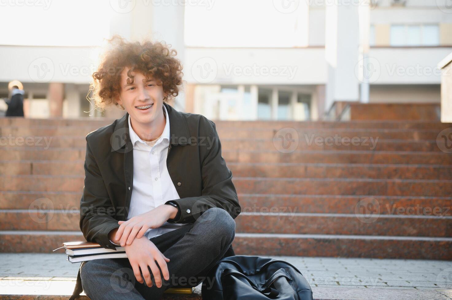 Cute school boy outside classroom photo