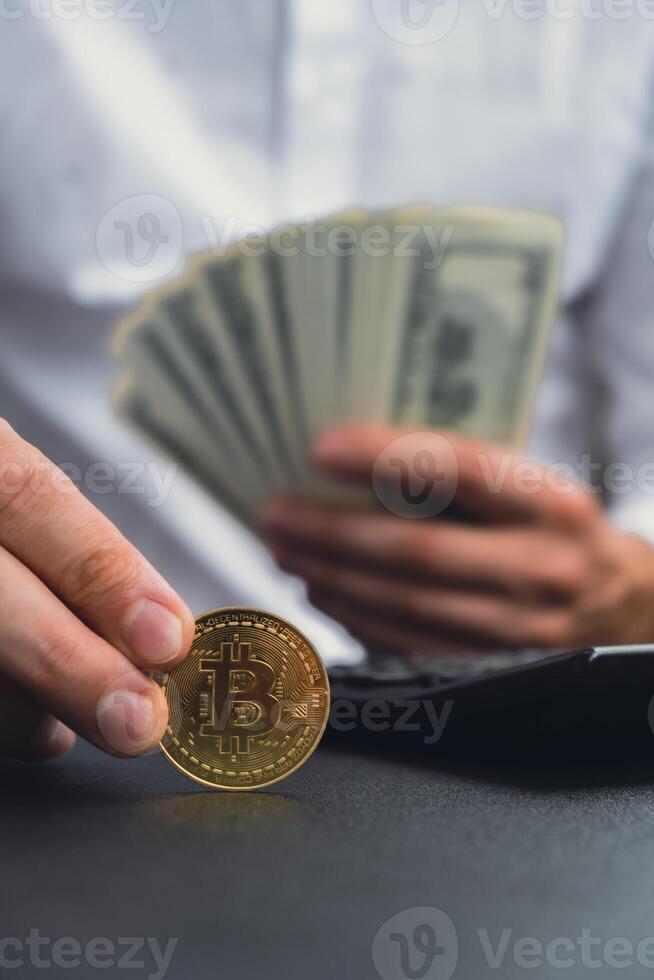 Bitcoin coin digital gold next to Expert trader hands counting income banknotes of dollar cash. Close up of hands unrecognizable Freelancer. Earned trading charts growth Cryptocurrency market investment concept. American bucks fund savings photo