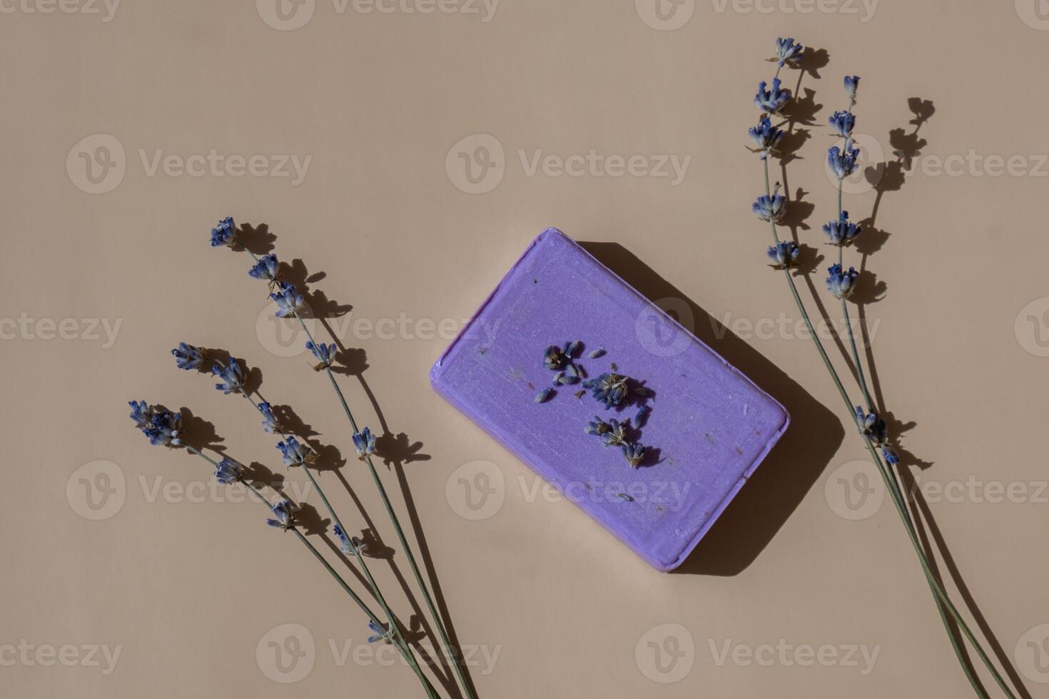 Handcrafted purple lavender soap with lavender flowers. Natural hydrating moisturiser softness cosmetic. Organic calming beauty skincare product. Herbal self care wellness alternative soap. Copy space photo