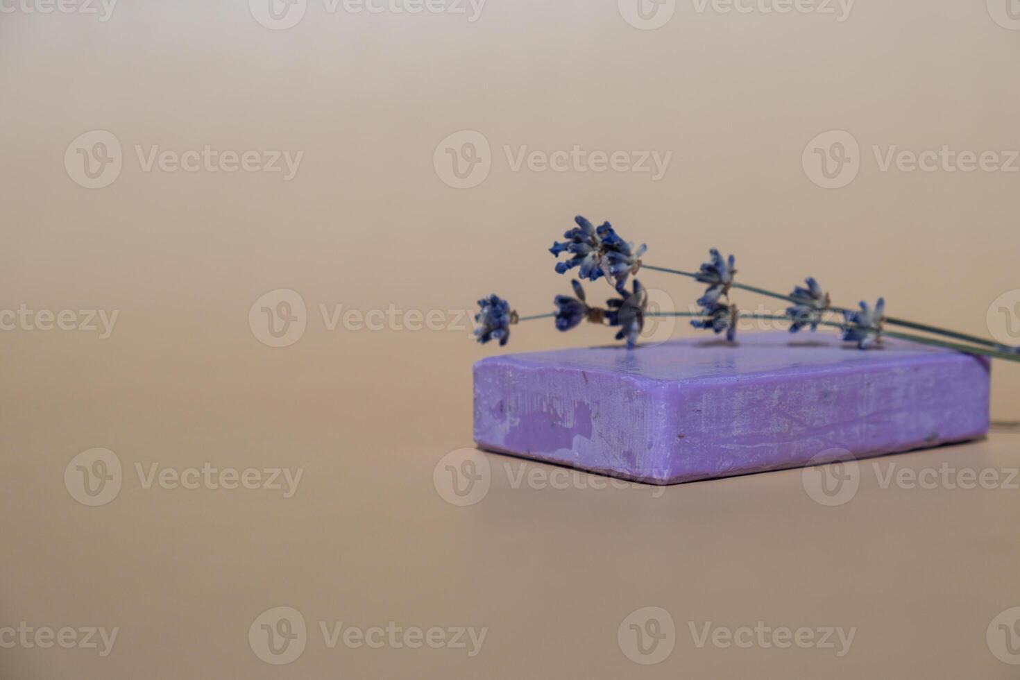 Handmade aromatic spa lavender soap. Natural additives and extracts. Bar of lavender soap with dried flowers. Beauty treatment product herbal ecological organic cosmetics. Copy space photo