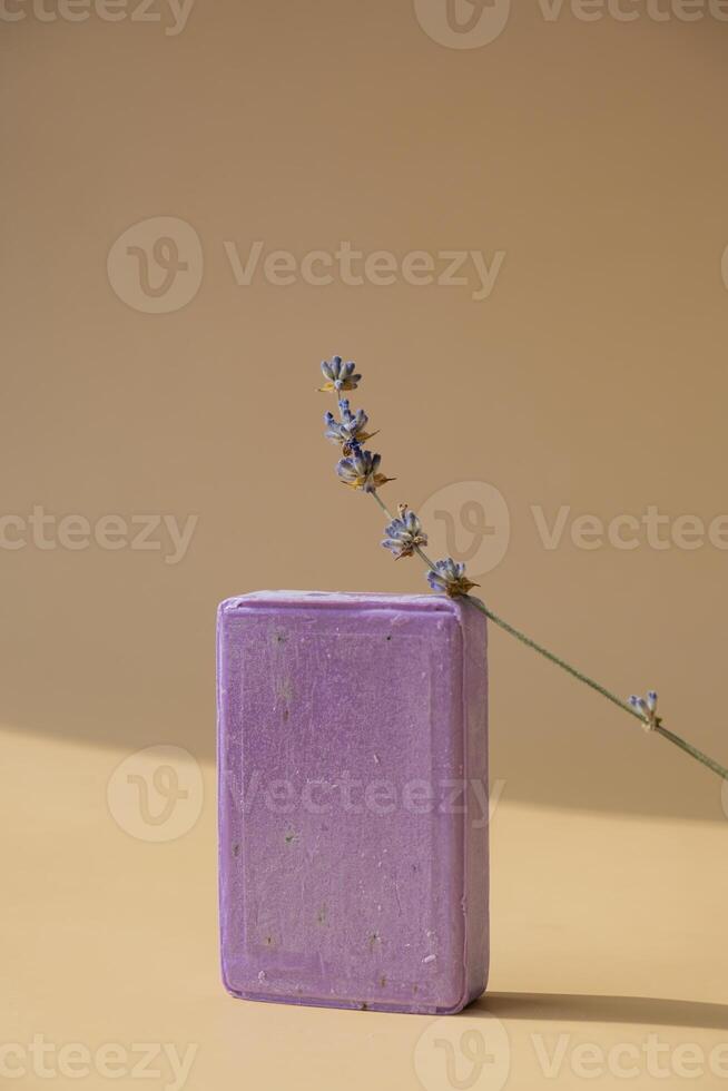 Handmade aromatic spa lavender soap. Natural additives and extracts. Bar of lavender soap with dried flowers. Beauty treatment product herbal ecological organic cosmetics. Copy space photo