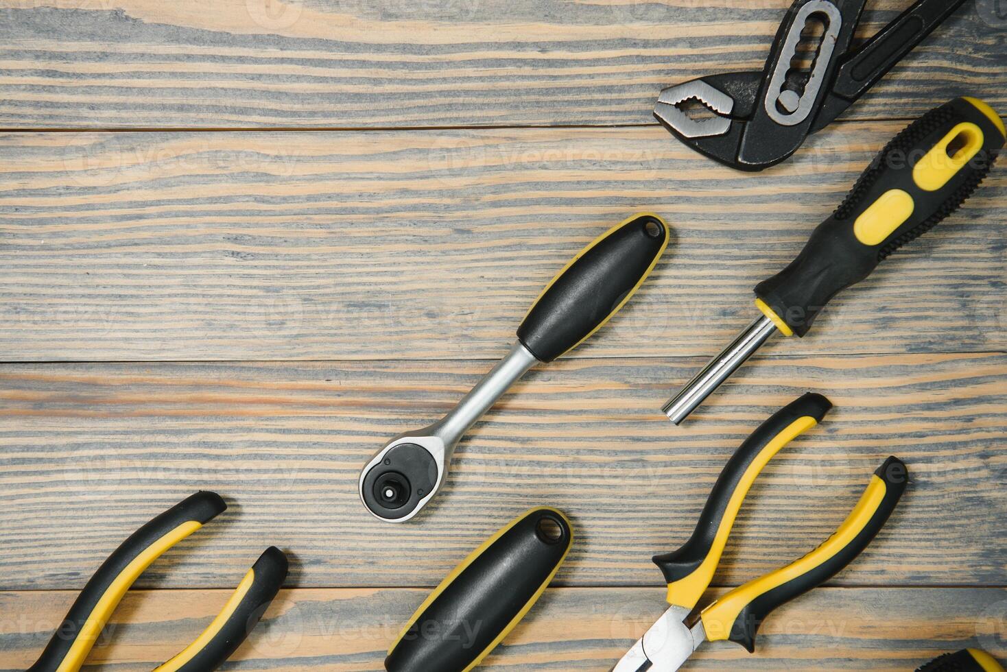 Various tools on wooden background photo