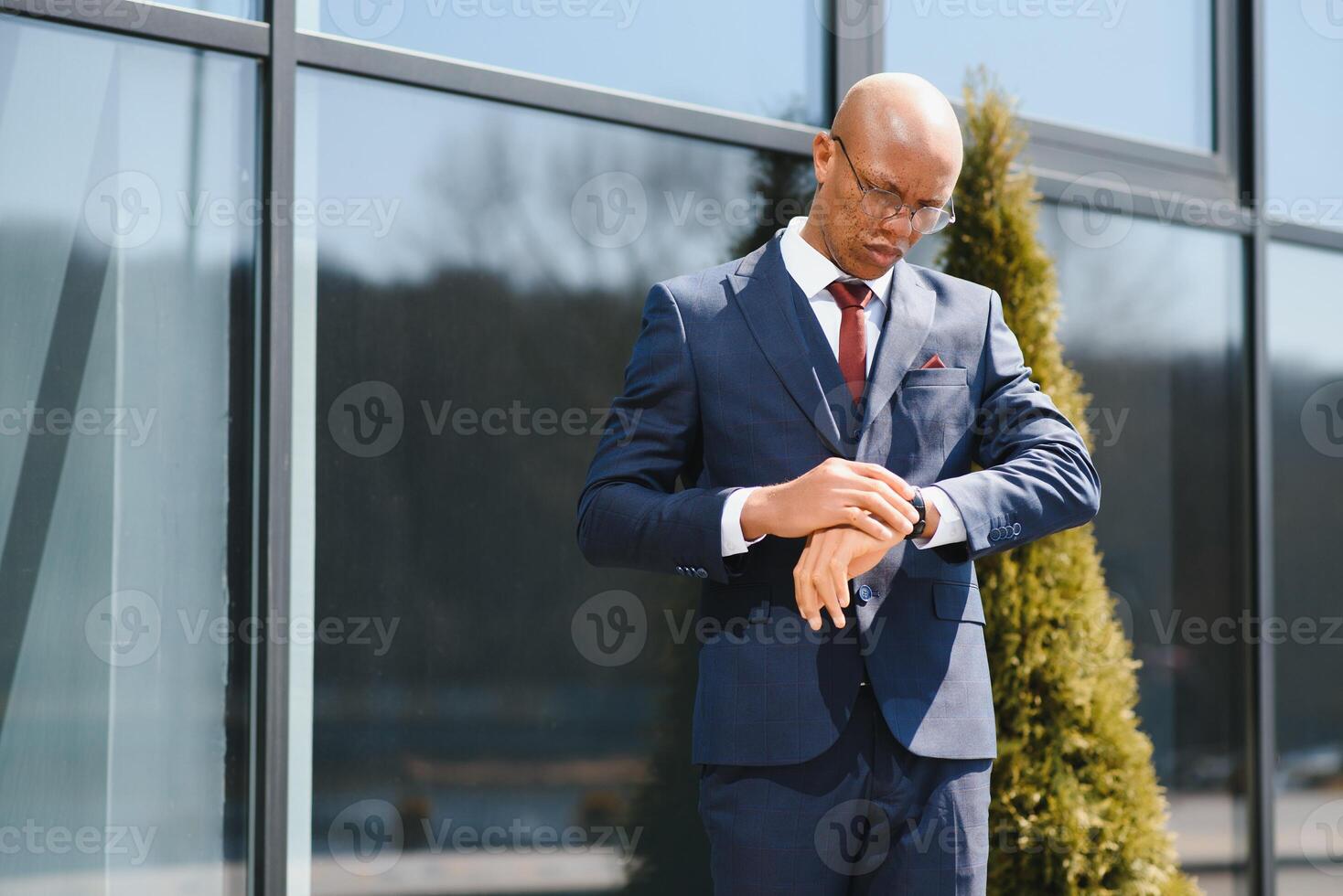 Portrait of confident african businessman standing outdoors photo