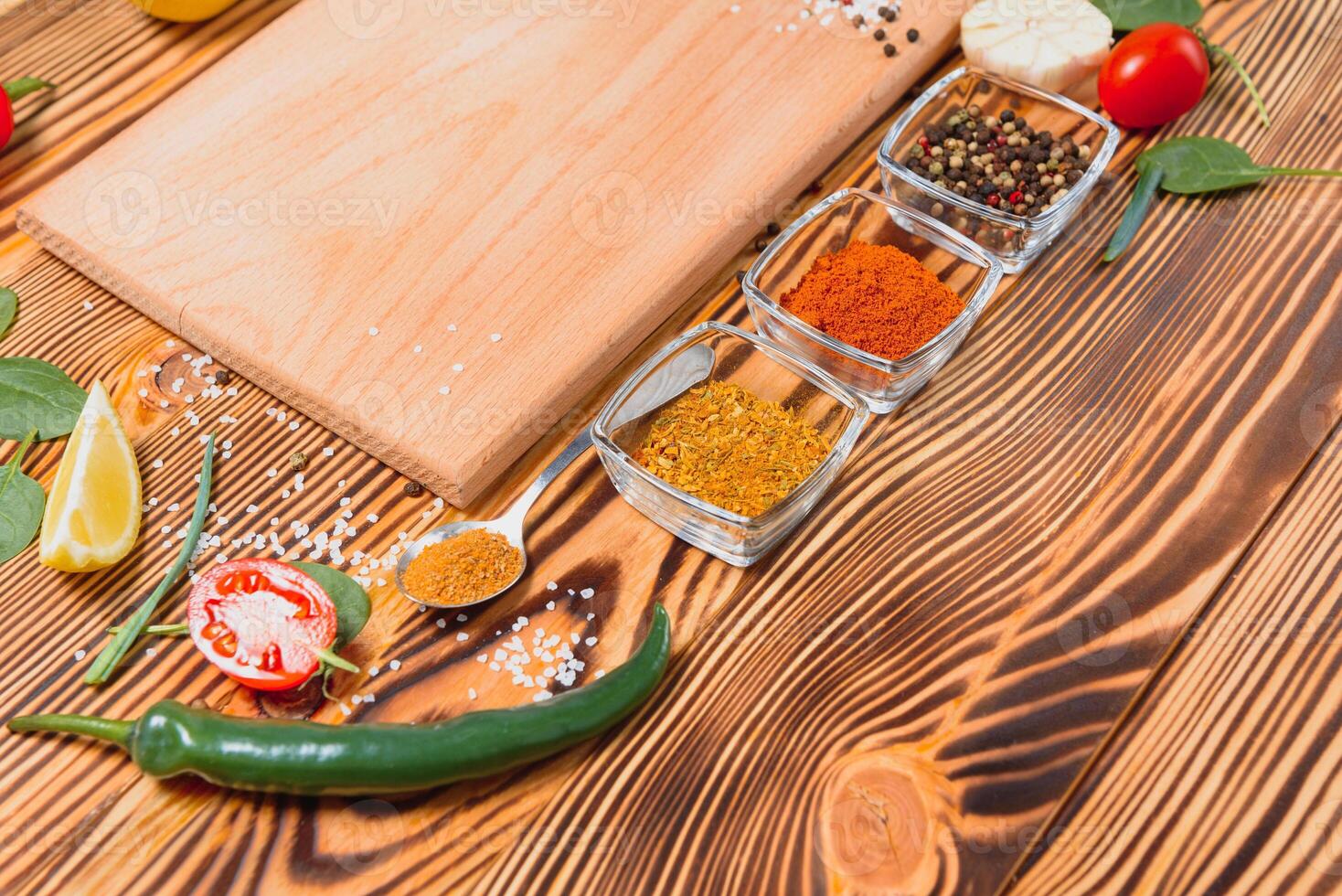 Cooking table. Background with spices and vegetables. Top view. Free space for your text. photo