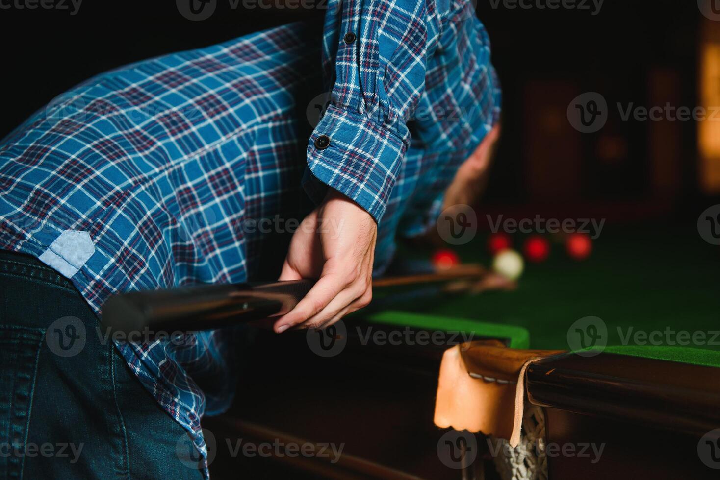 Playing billiard - Close-up shot of a man playing billiard photo