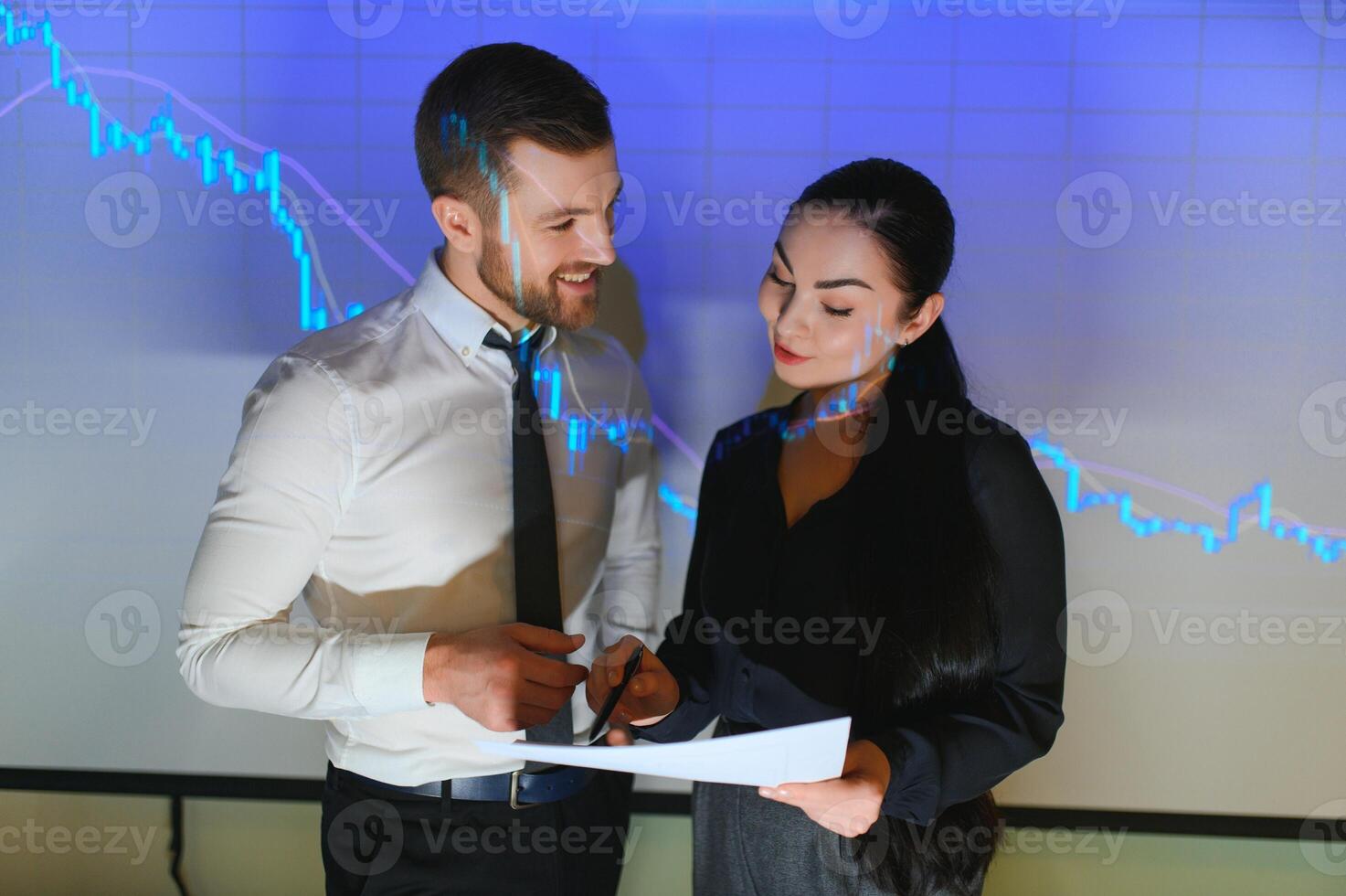 Analyzing data, graphs and reports for investment purposes. Creative teamwork traders. photo
