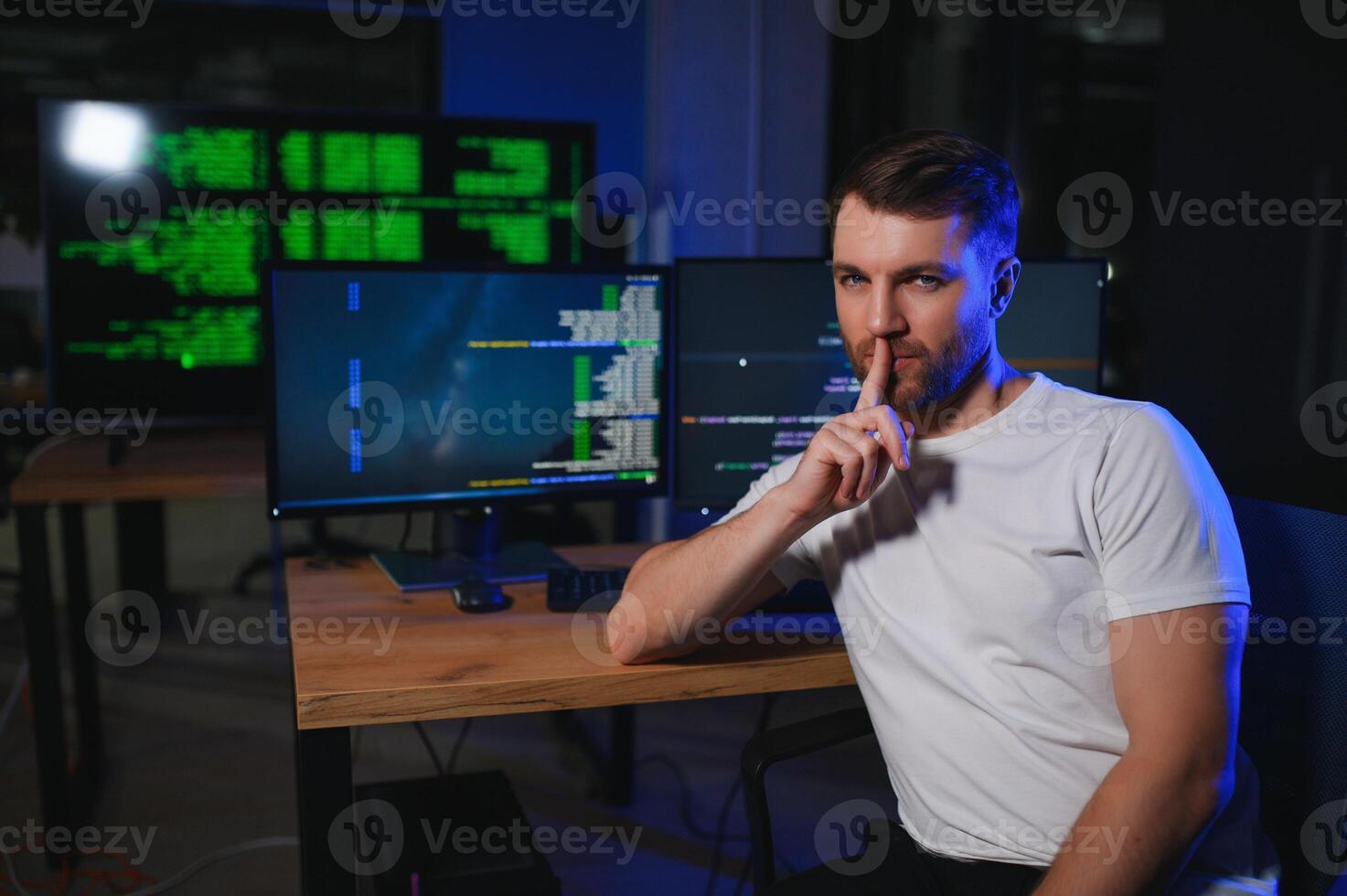 Young Handsome Man in Working on Desktop Computer. Digital Entrepreneur Typing Code photo