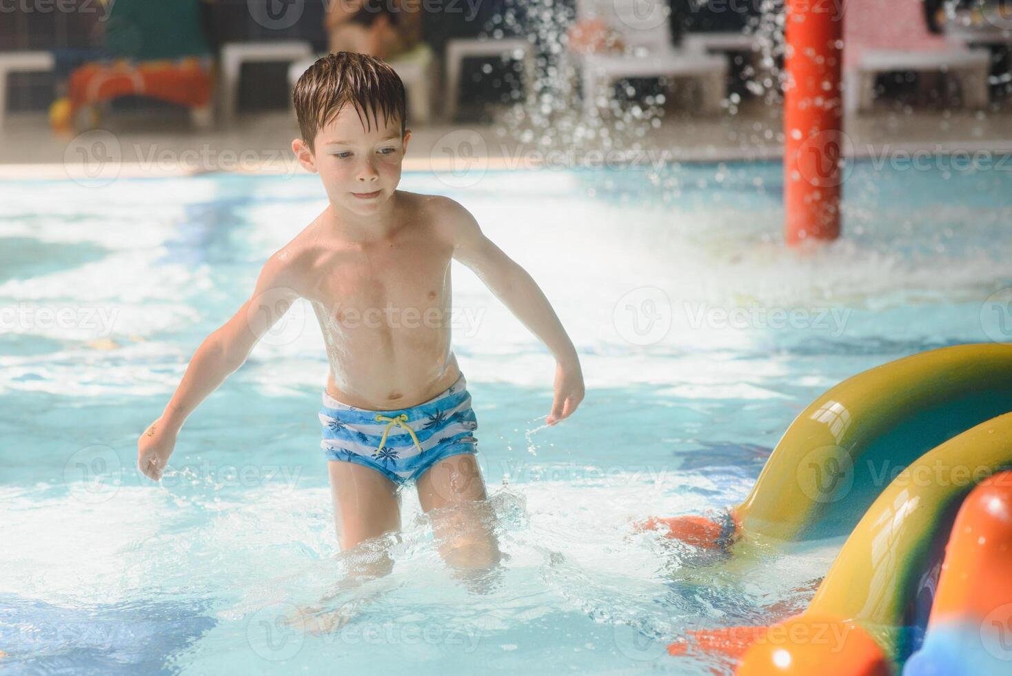 boy is in the water park. photo