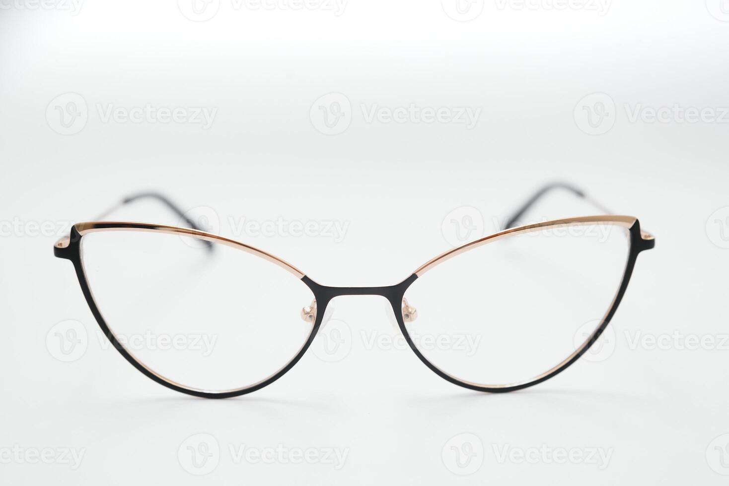 Female eyeglasses macro detail over a white background. Horizontal photo