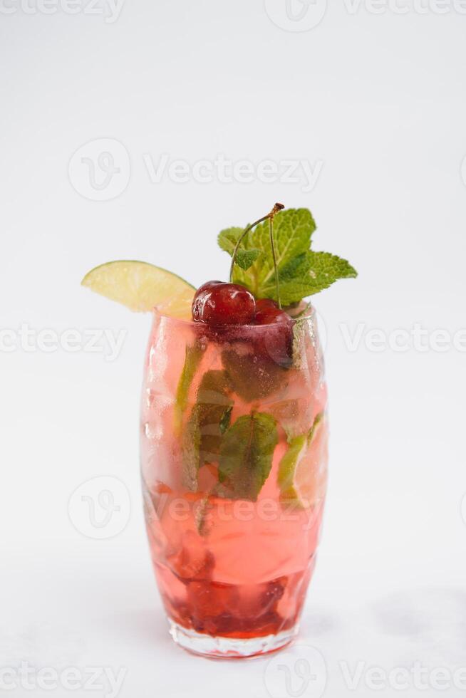 Glasse Of Drink With Ice Cubes And Fruits On White Background. photo