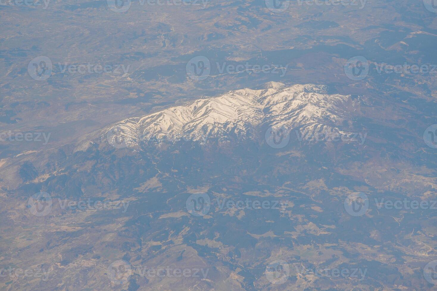 Looking through window aircraft during flight in wing with a nice blue sky photo