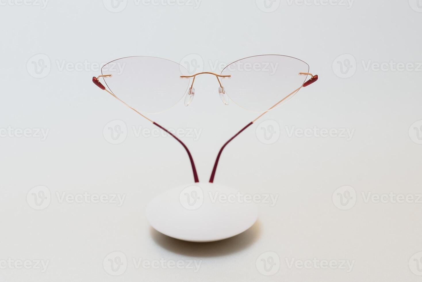 Stylish eyeglasses. Modern eyeglass frames on a colored background photo