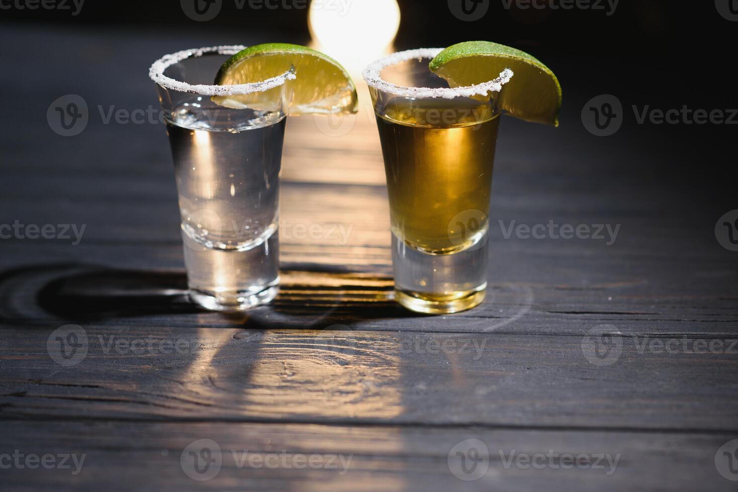 Mexican tequila with lime and salt on rustic wood background. space for text. concept luxury drink. Alcoholic drink concept. photo