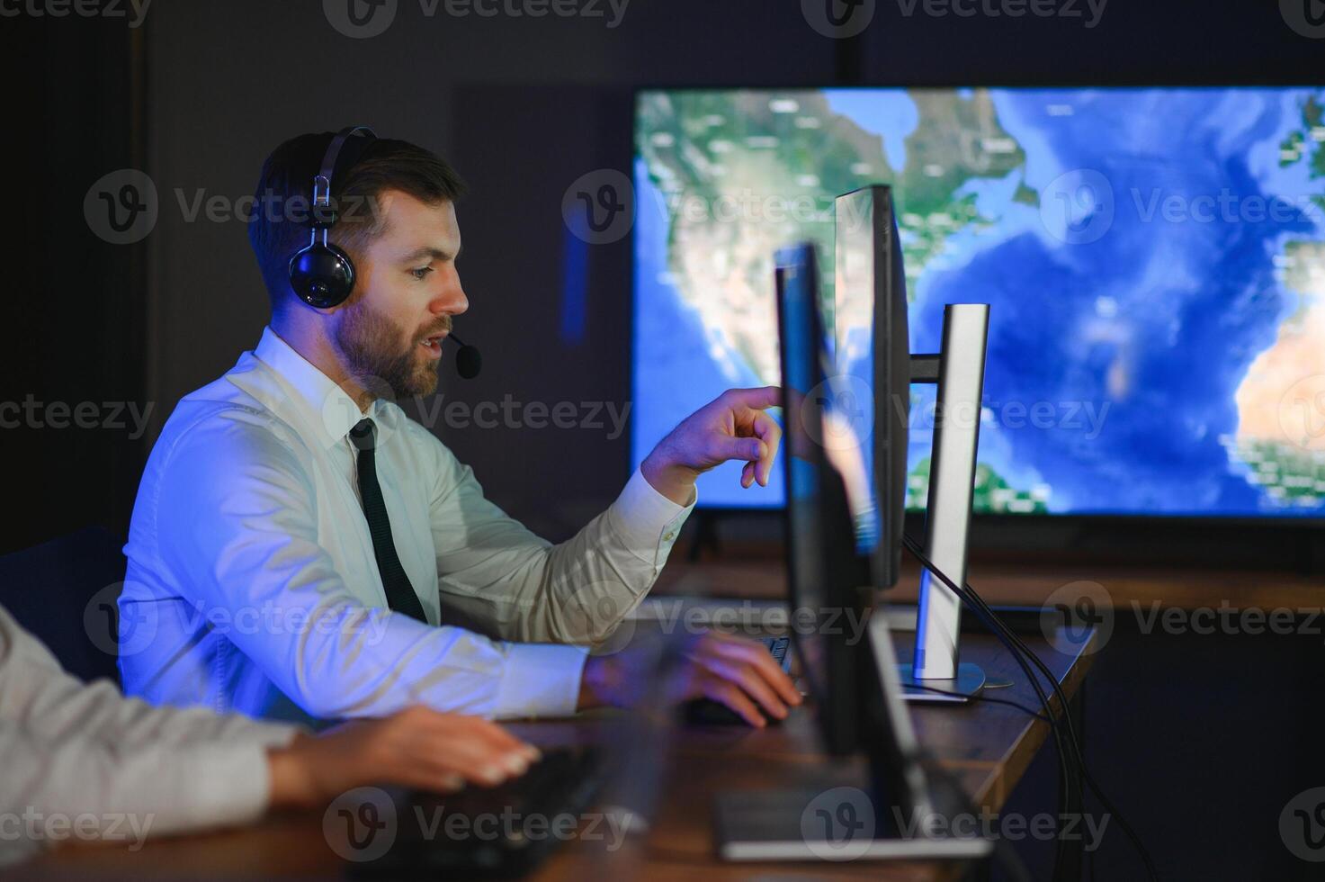 Police dispatch, communication headset and man talking, speaking and consulting with security photo