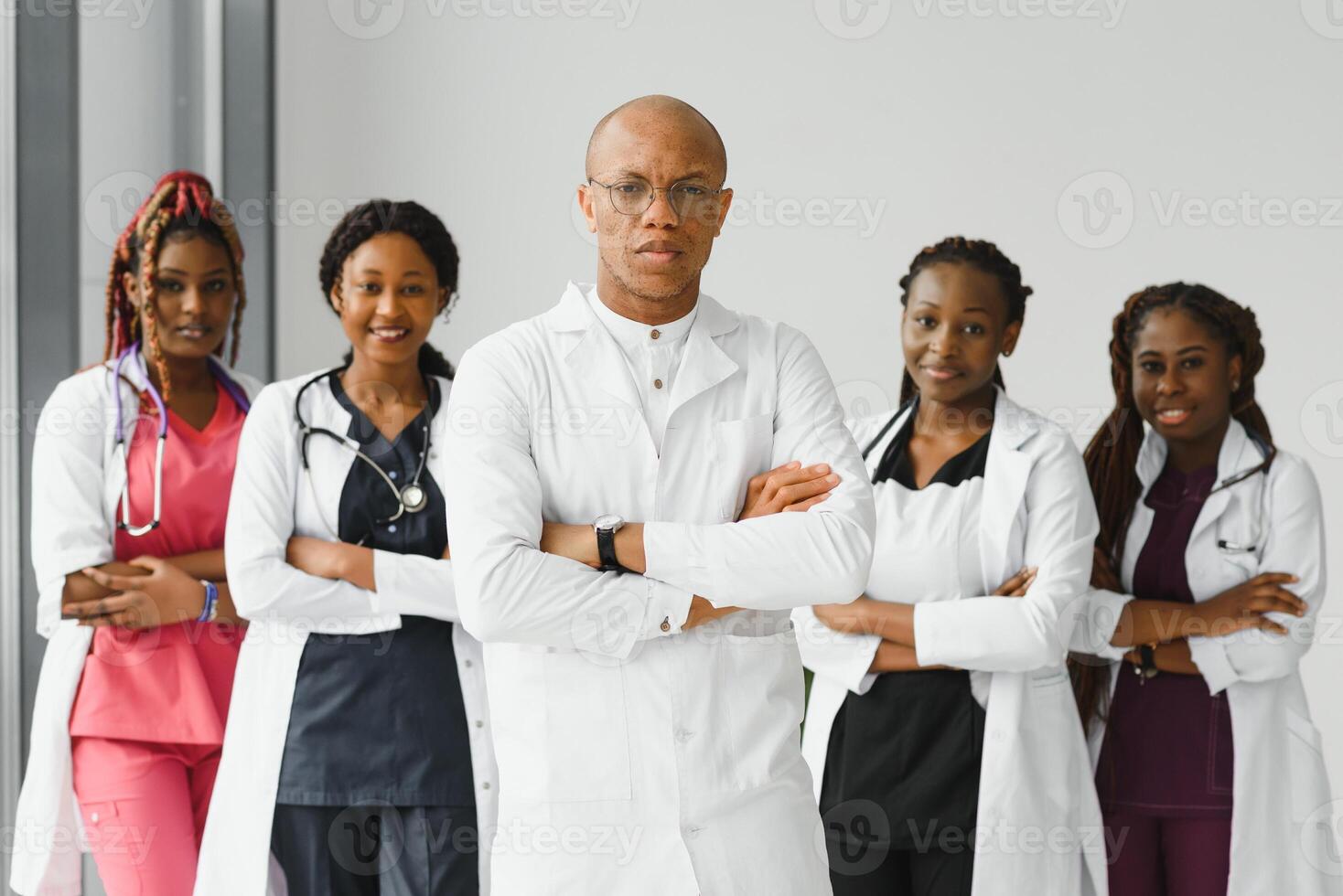 confident african medical doctor and colleagues portrait in hospital. photo