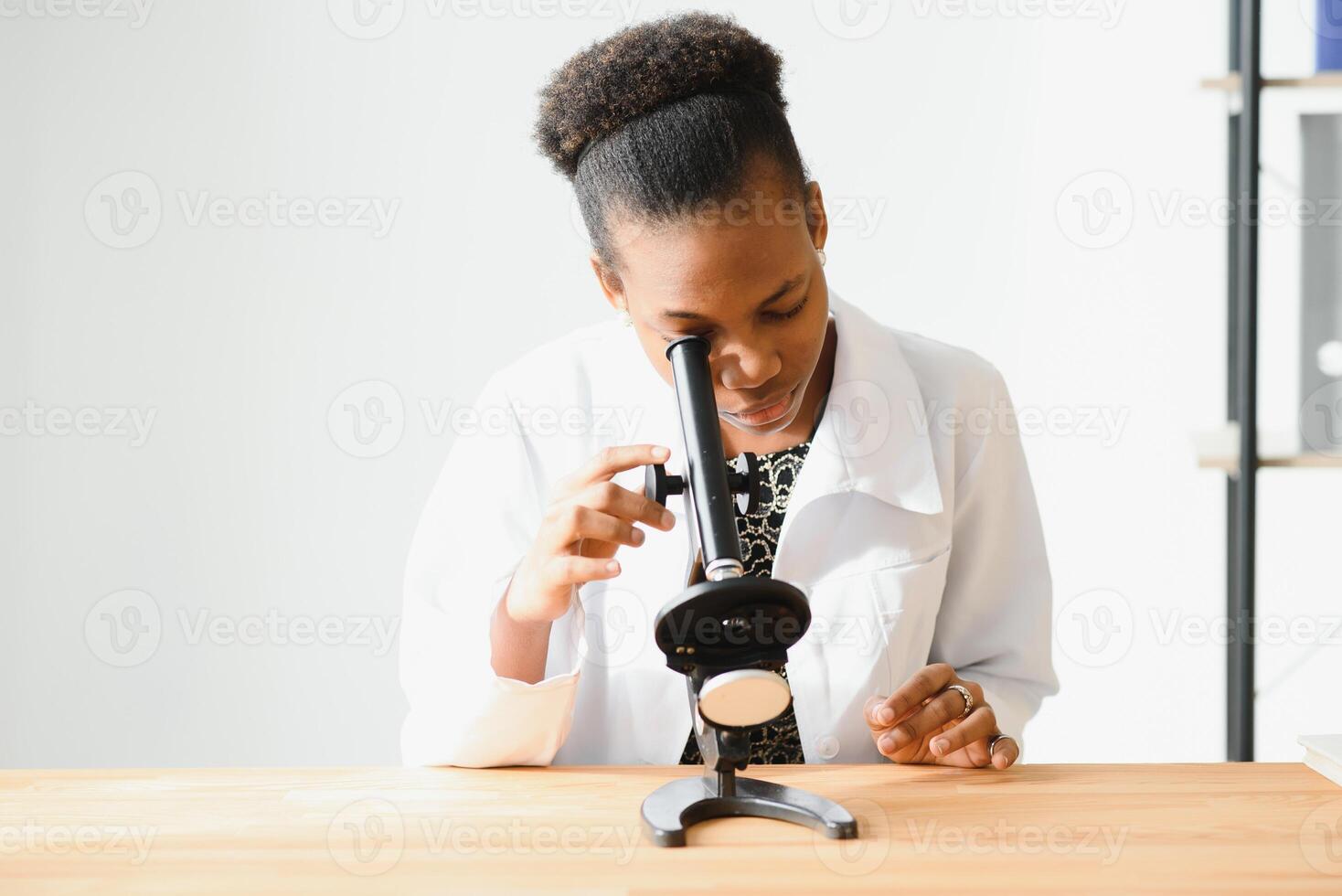 Medical doctor woman working at laboratory - copyspace. photo