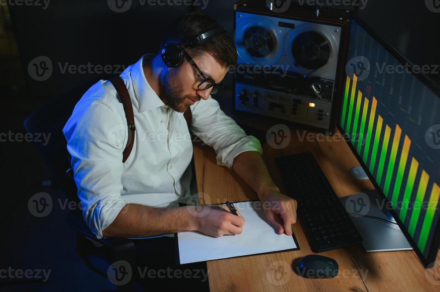 A police officer records a telephone conversation on a tape recorder. secret agent photo