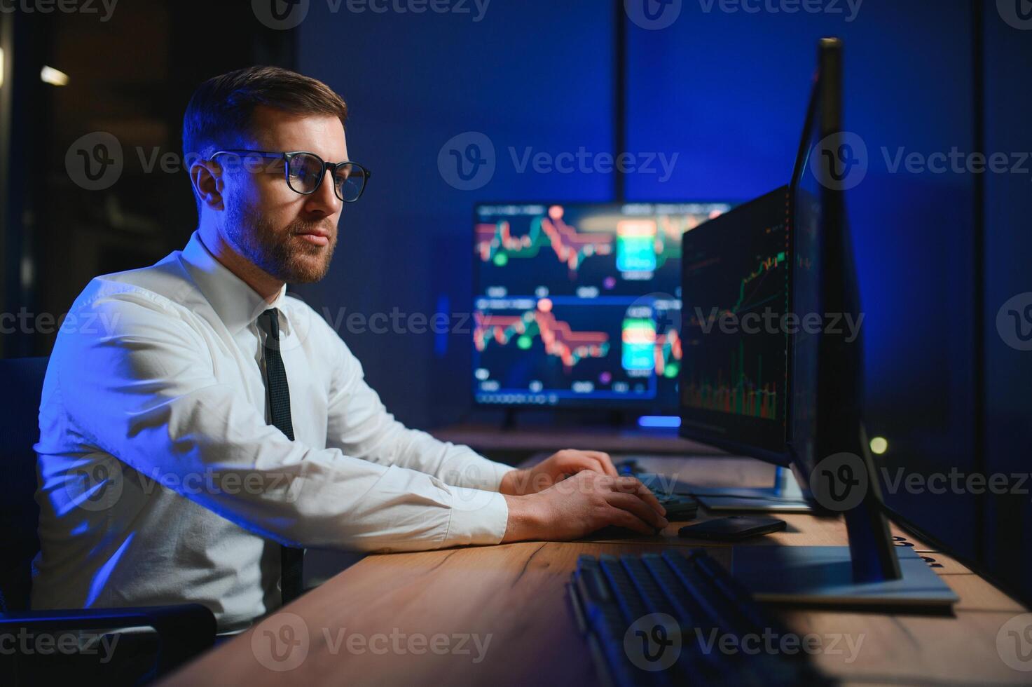 Financial Analyst. Businessman Works in Investment Bank Downtown Office at Night photo