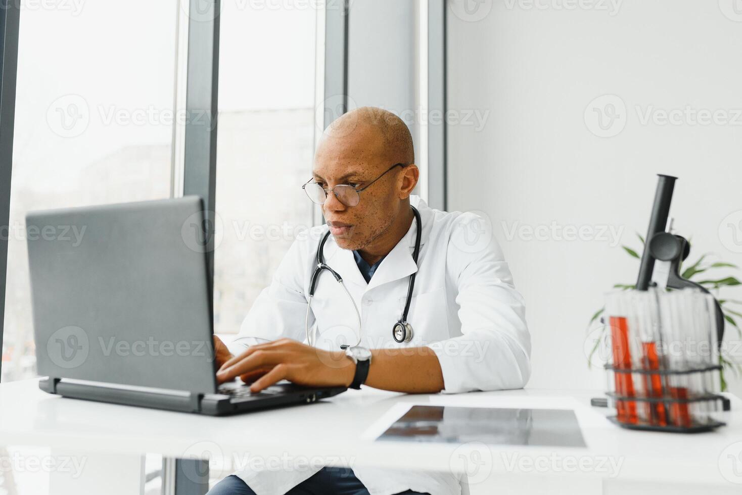 young male african doctor in hospital. photo