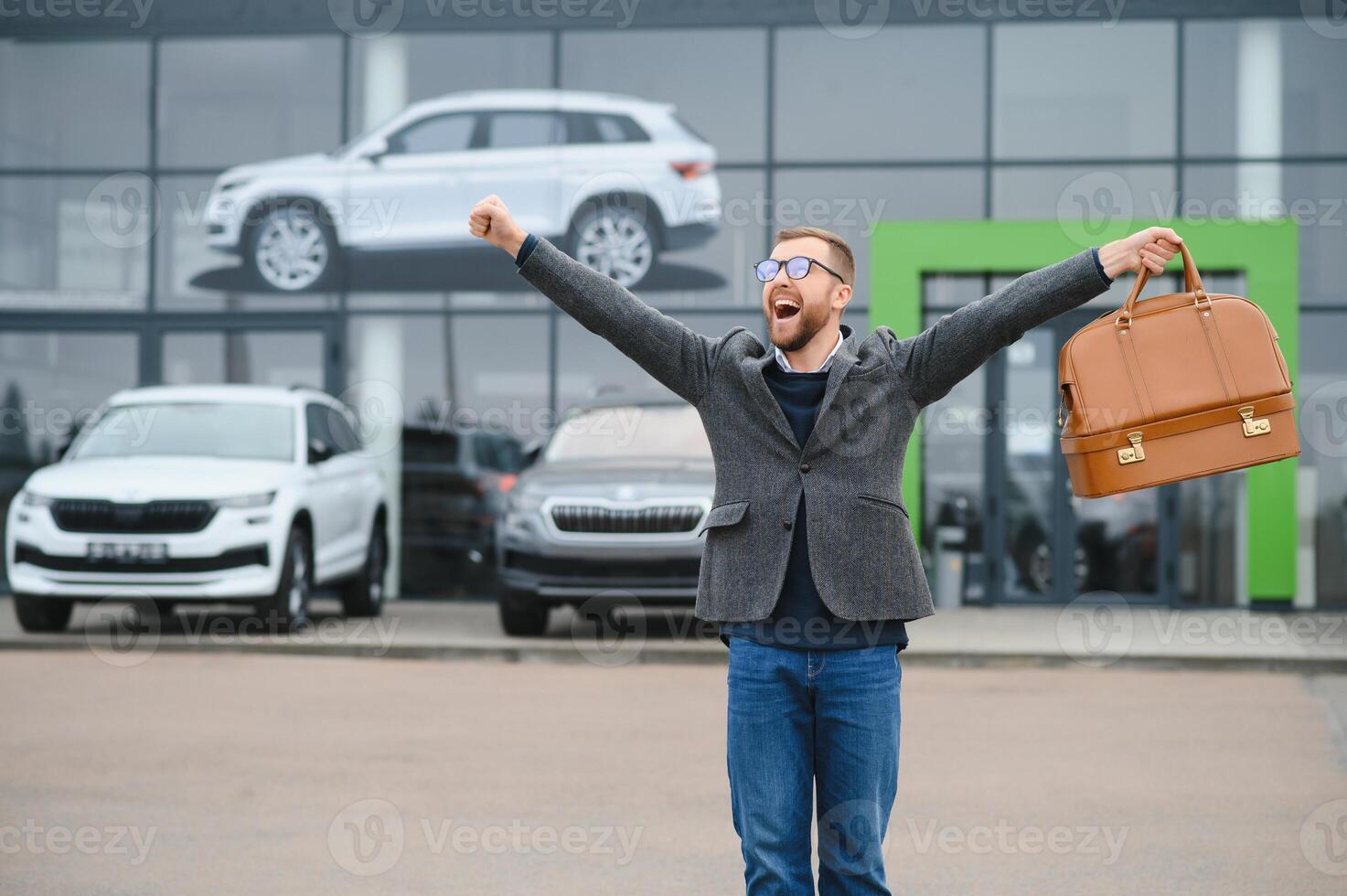 Portrait of happy customer buying new car. photo