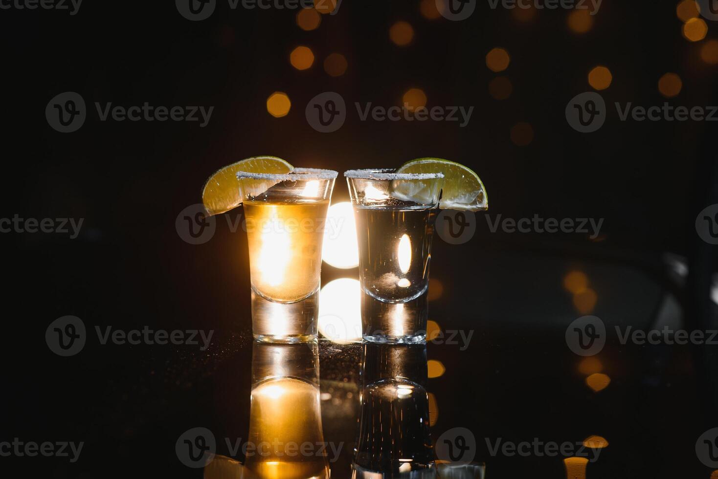 Mexican tequila with lime and salt on rustic wood background. space for text. concept luxury drink. Alcoholic drink concept. photo