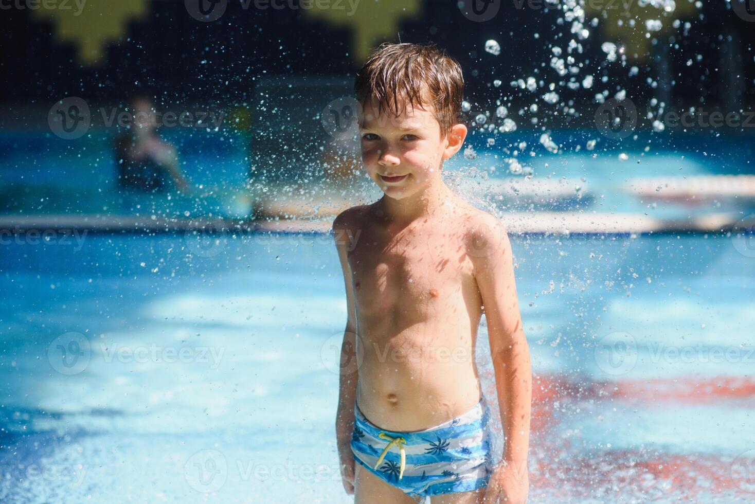 Boy having fun in aqua park photo