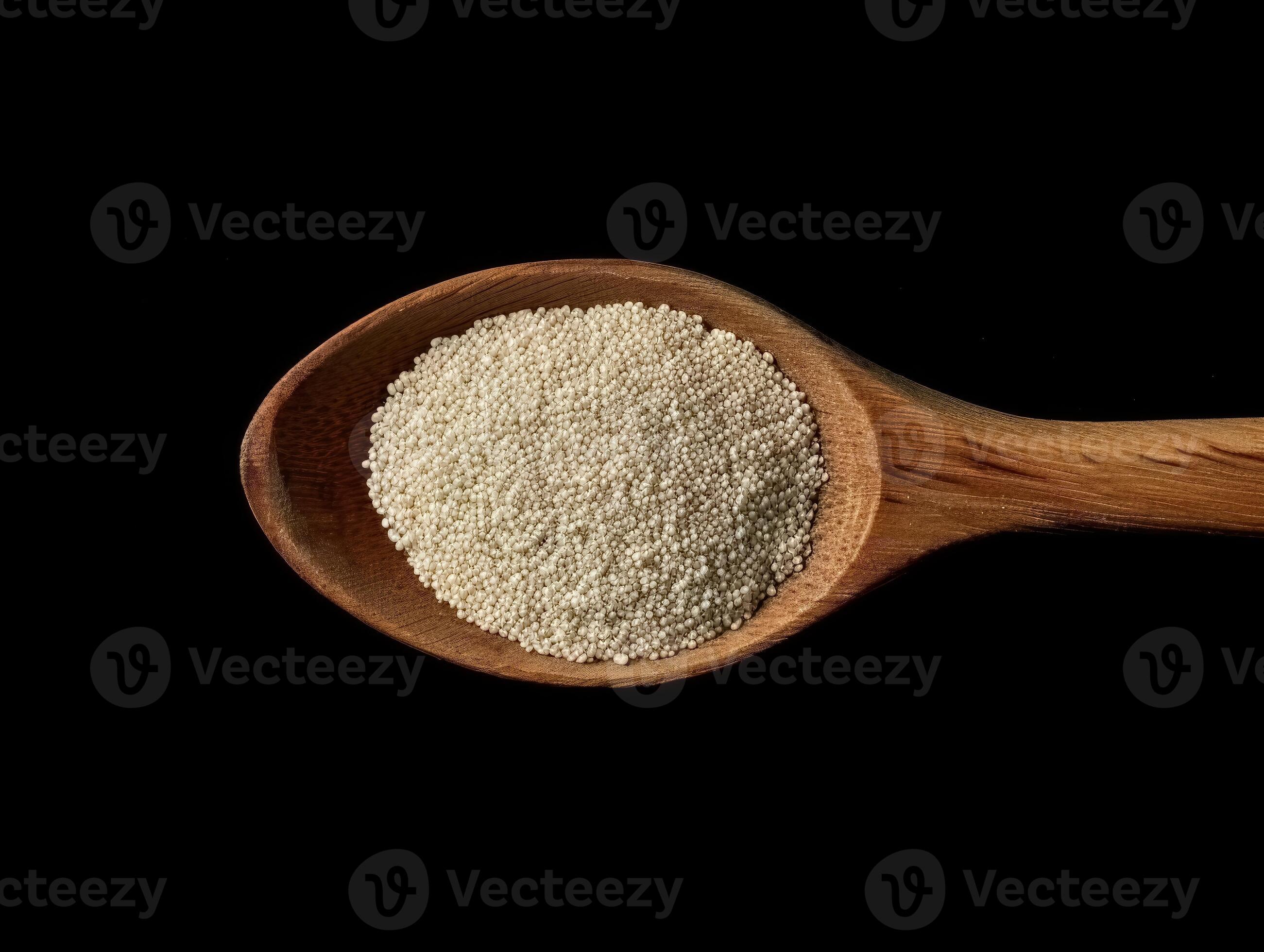 AI generated Active dry yeast granules pile with wooden spoon 40332011