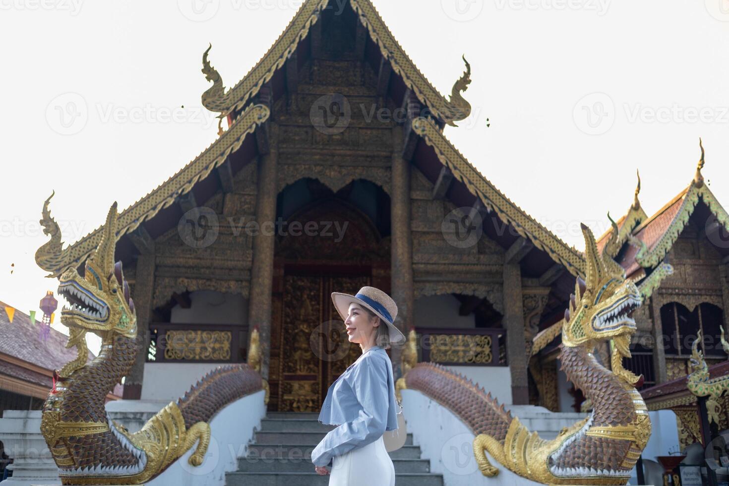 Traveler Asian woman traveling and walking in Bangkok Chiang Mai Temple, Thailand, backpacker female feeling happy spending relax time in holiday trip photo