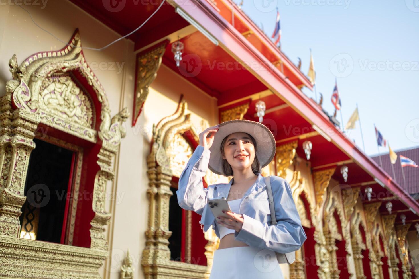 Traveler Asian woman traveling and walking in Bangkok Chiang Mai Temple, Thailand, backpacker female feeling happy spending relax time in holiday trip photo