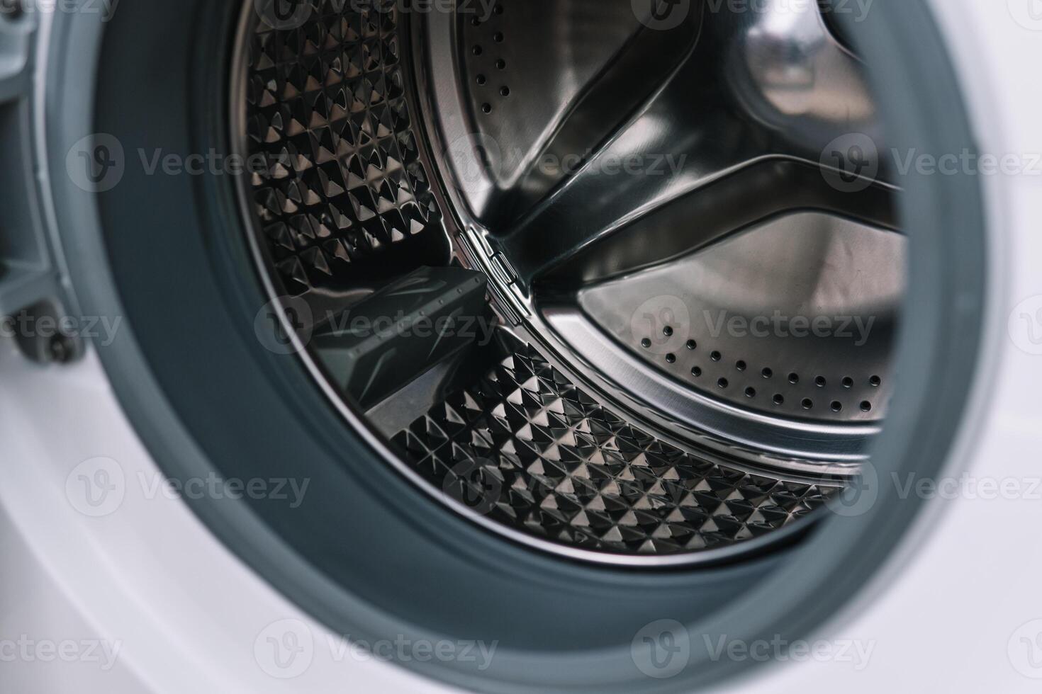Washing dryer machine inside view of a drum close up photo