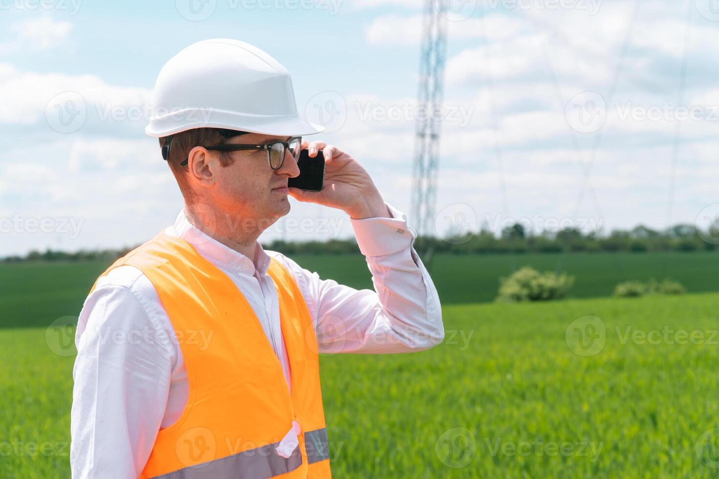 Engineer working near transmission lines. Energy efficiency conception photo