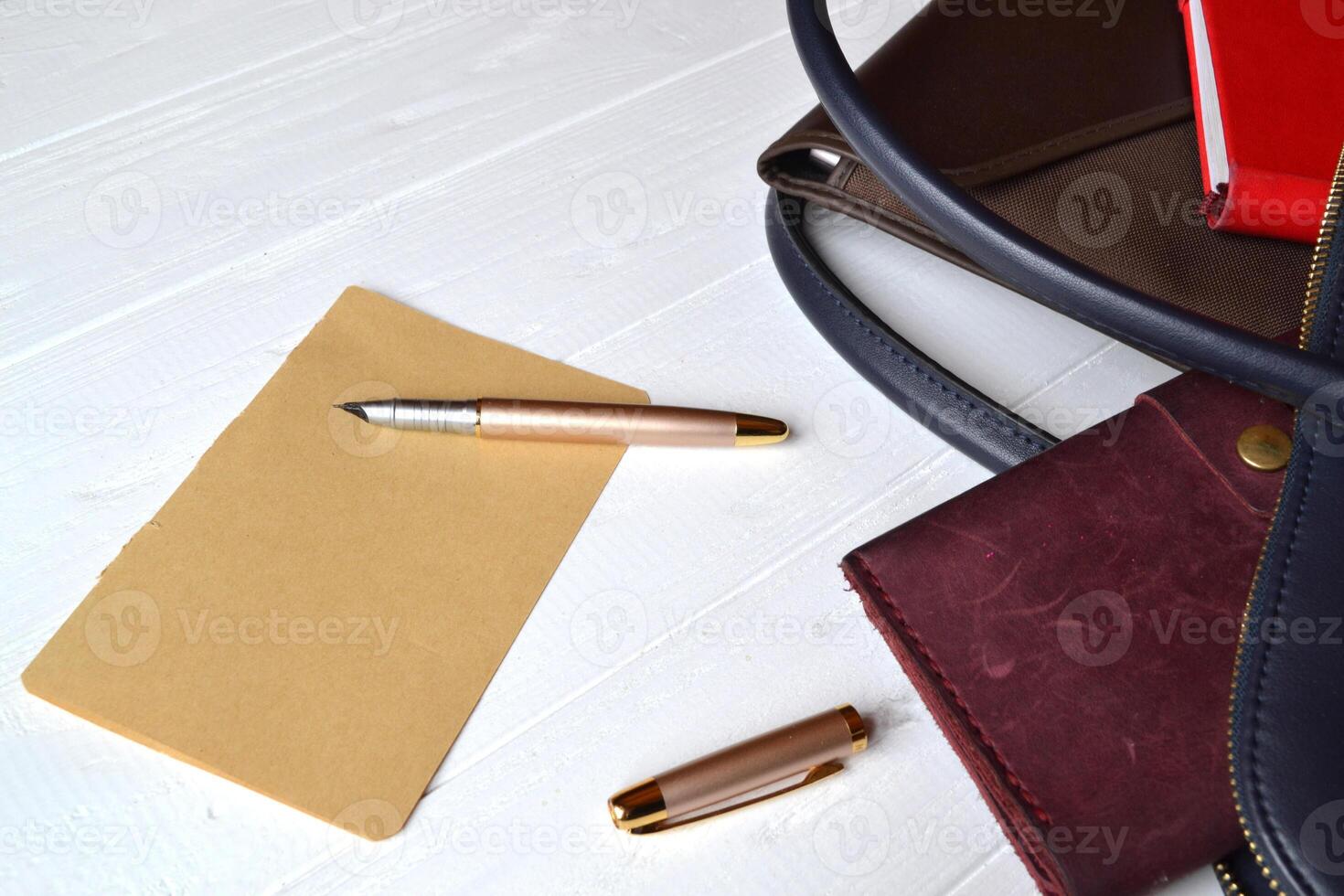 Business bag and empty paper on the desk. Business flat lay. photo