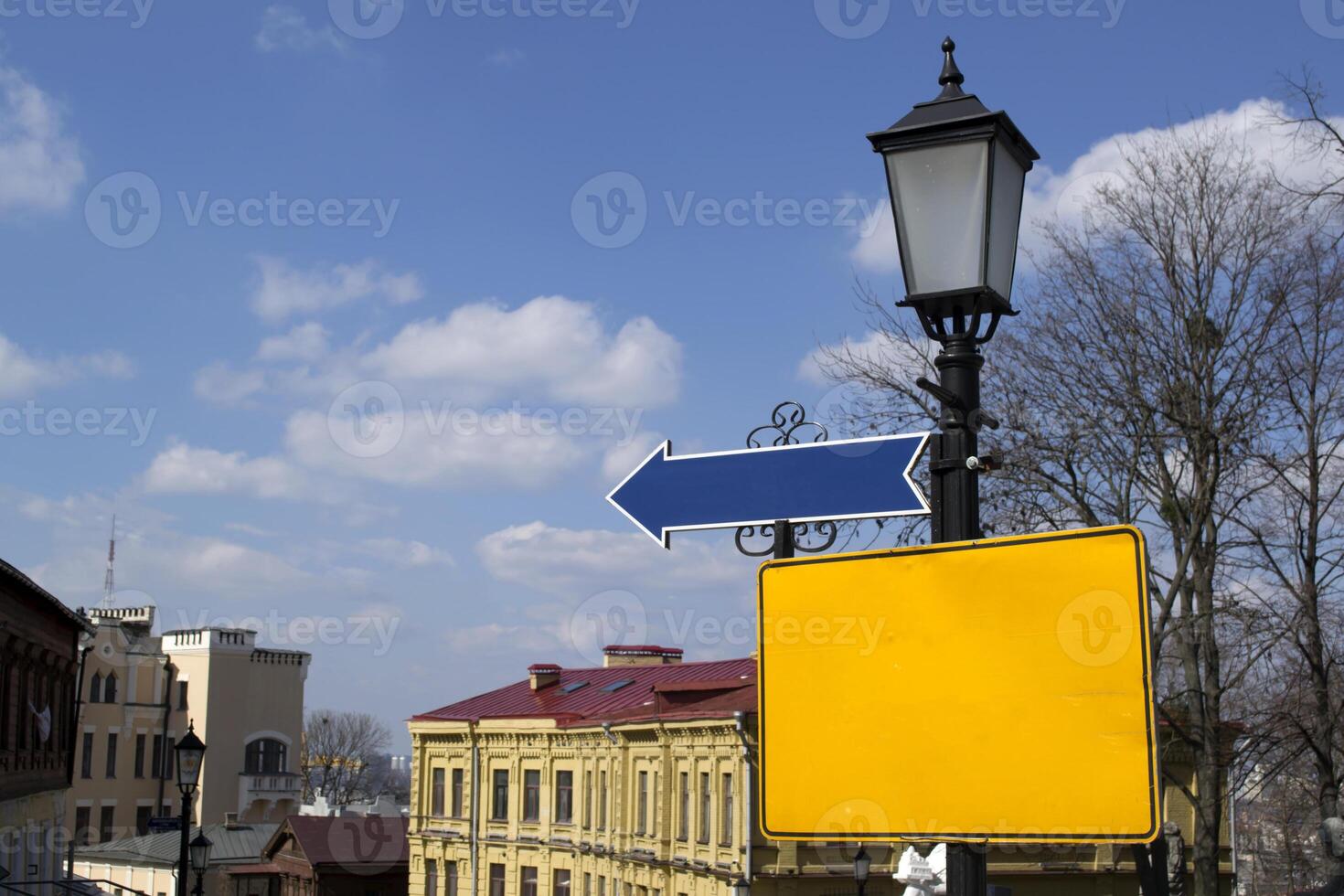 Empty pointers on a street lantern. photo