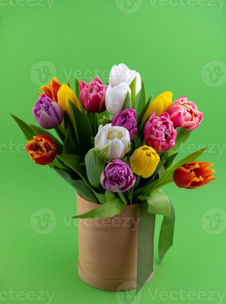 Bouquet of tulips. Flower delivery. Green background . Tulip. photo