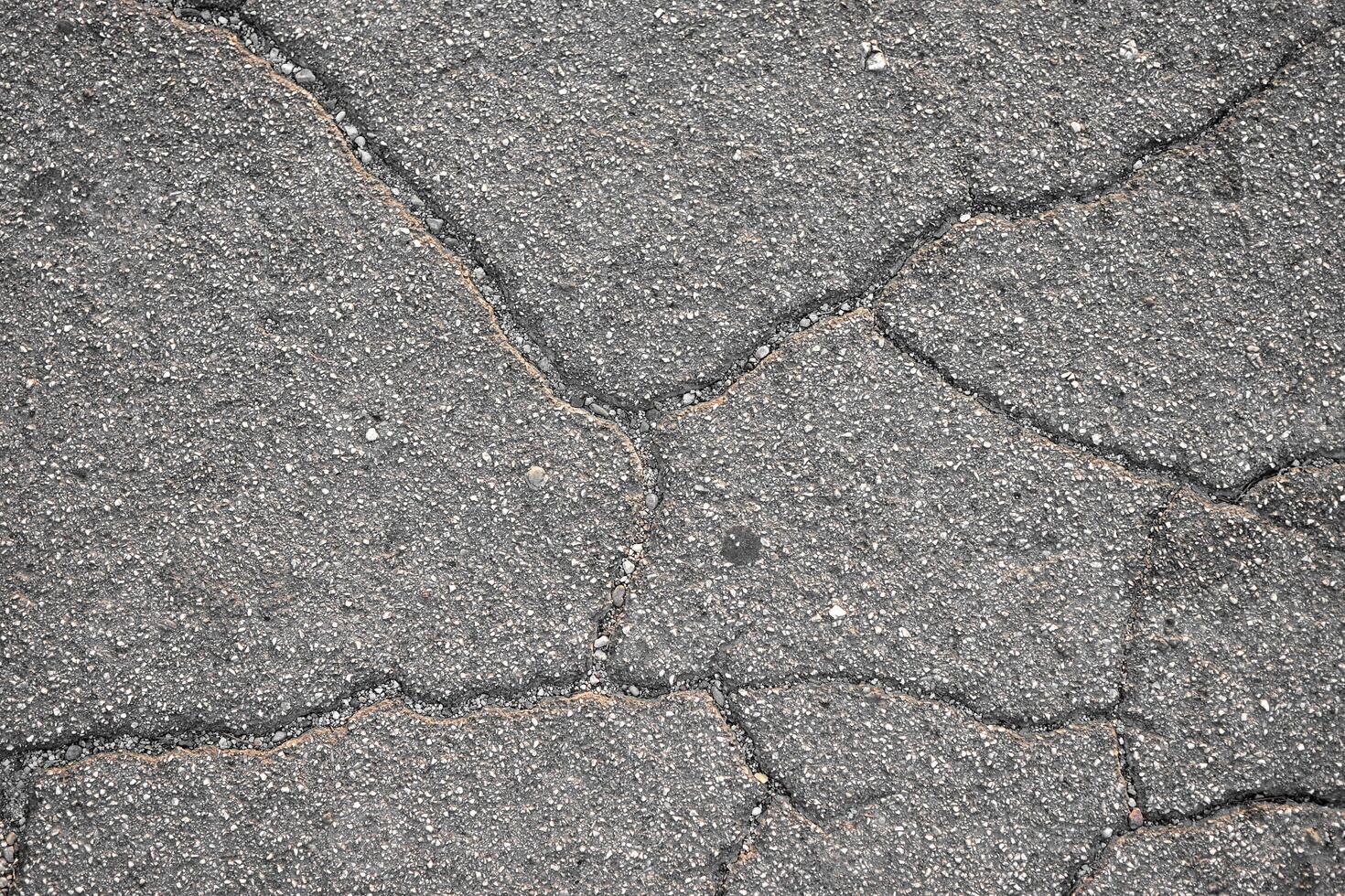 Concrete background with rough deep crack. Gray back. Grunge photo