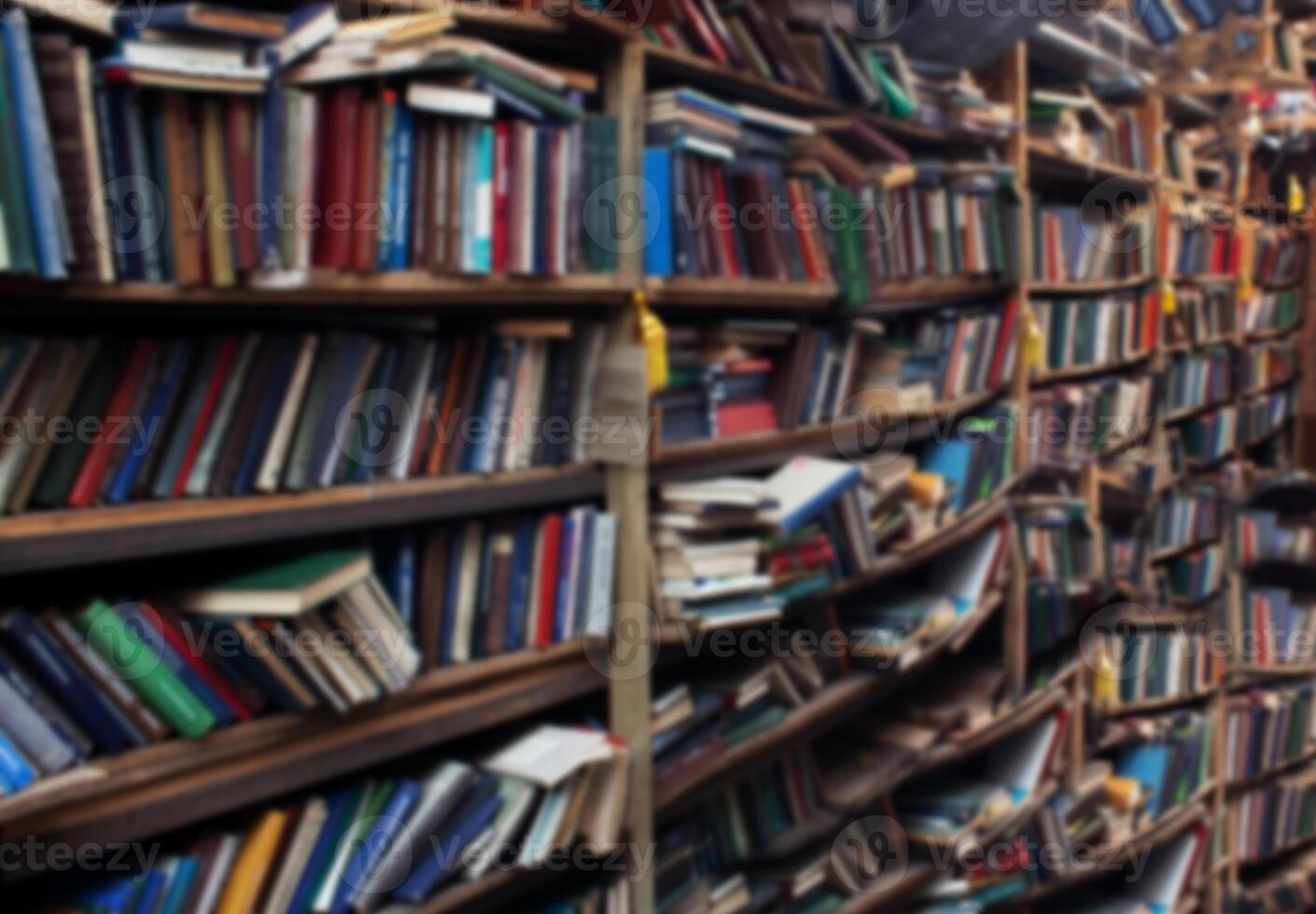 Book background. Selective focus. Blurred texture of old books. Bookshelves in the library photo