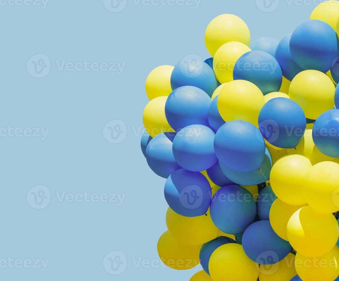 Yellow and blue balloons. Big bunch of balls. Balloon background with place for text. photo