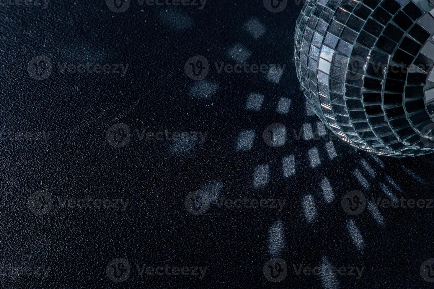 Mirror disco ball. Black background. photo