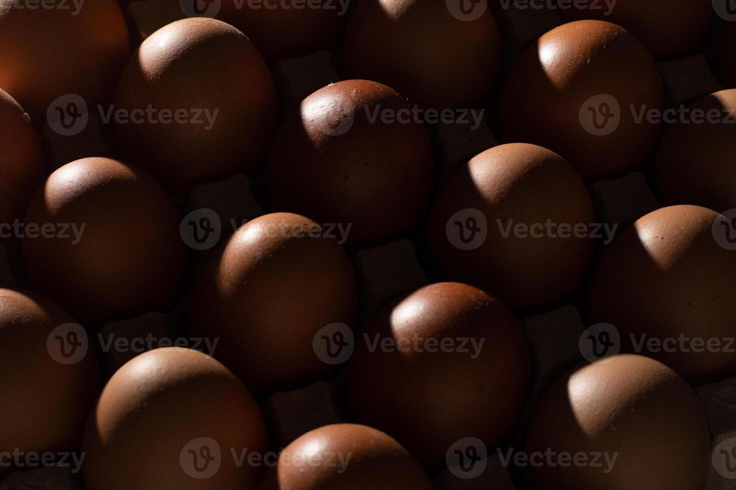 Egg background. Brown eggs in a tray. Protein food. Eco organic. Minimalism concept. photo