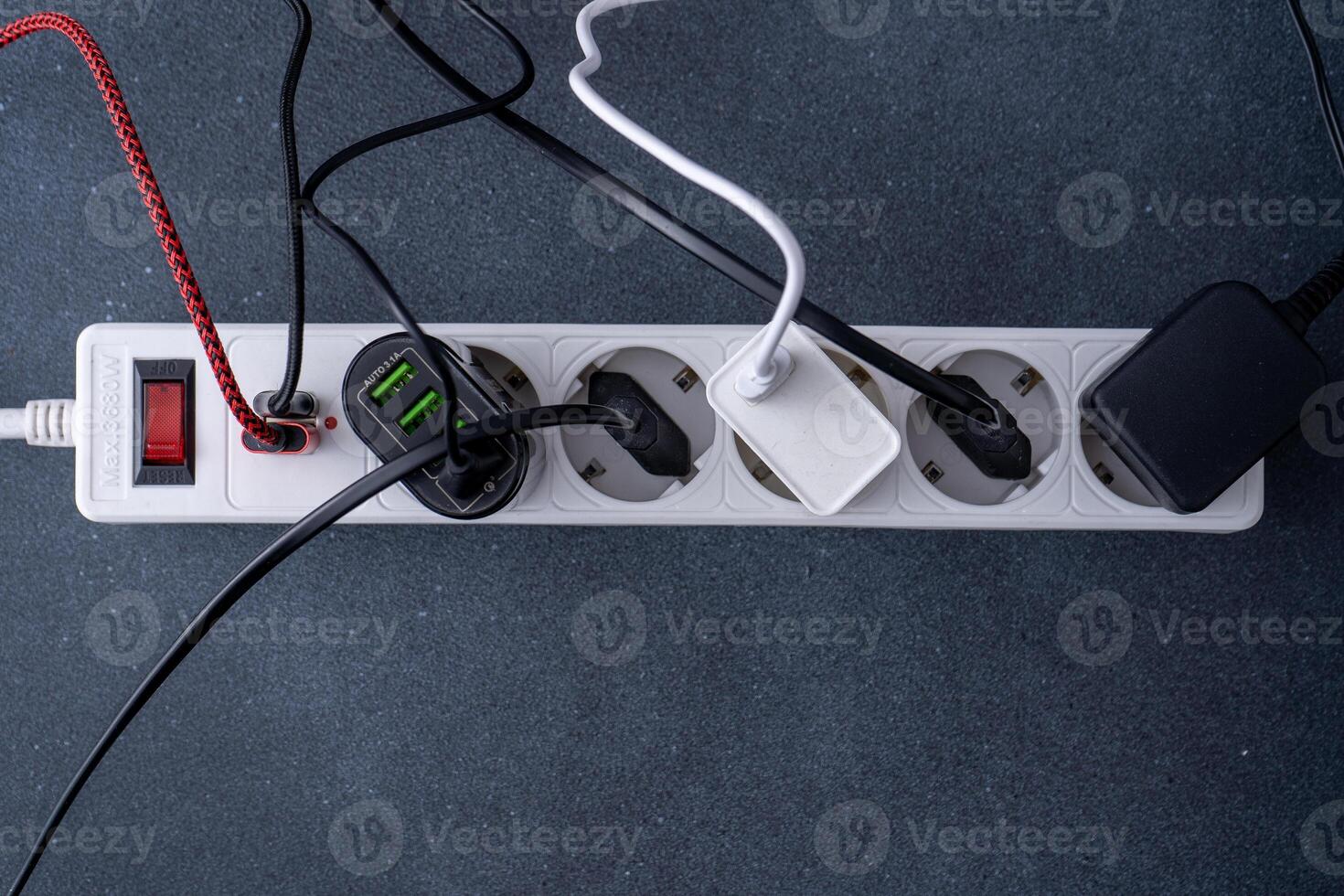 Electrical outlet extension cord. White cable with USB connector for charging phones. Electrical appliance. Extension cable photo