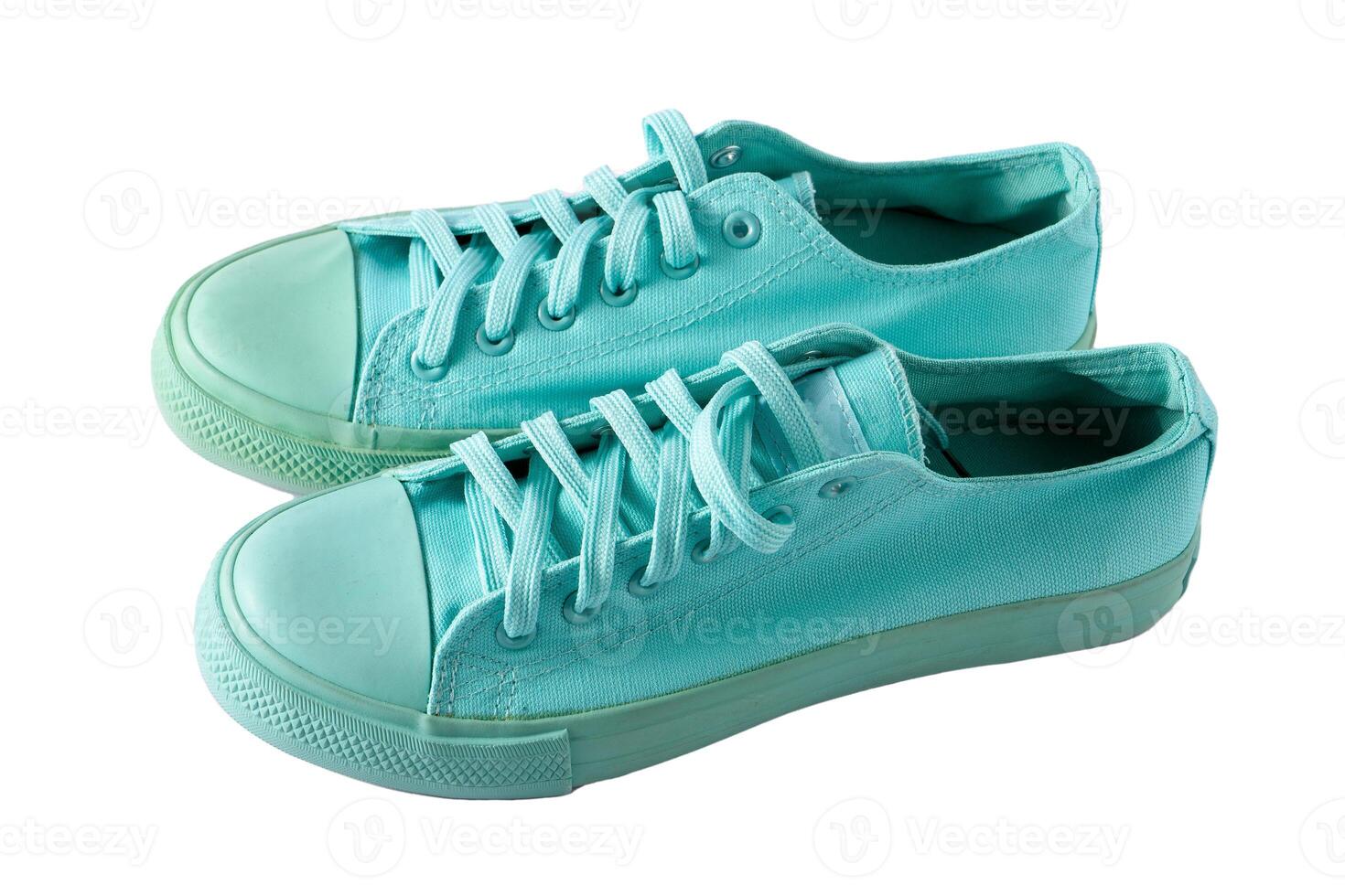 Turquoise sneakers isolated. A pair of mint shoes. Sports shoe. photo