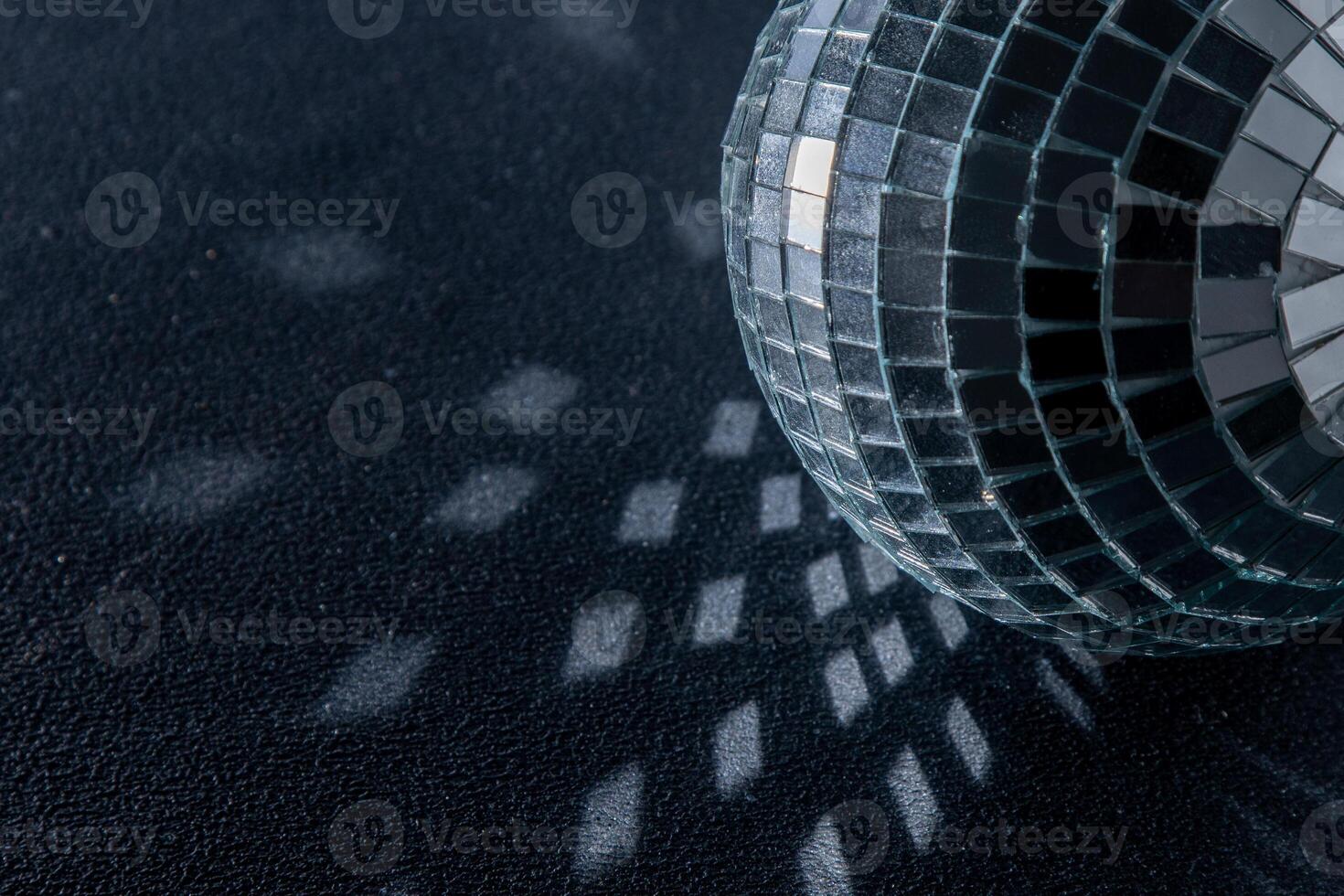 Mirror disco ball. Black background. photo