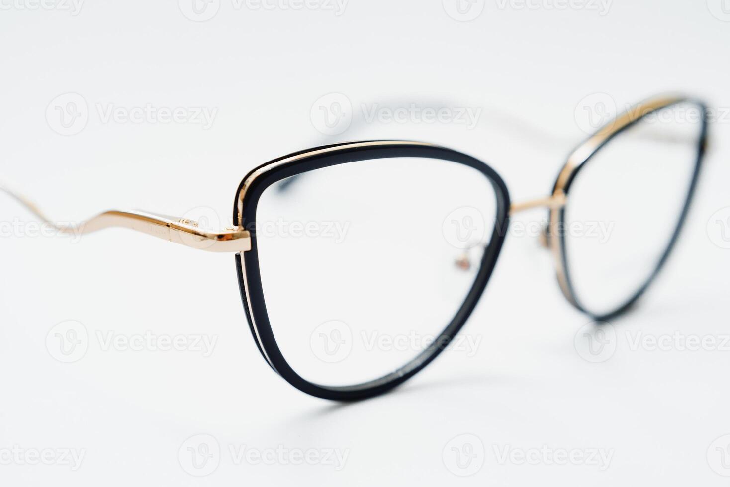 Black glasses on a white background, hipster style, plastic frames, the concept of poor vision photo