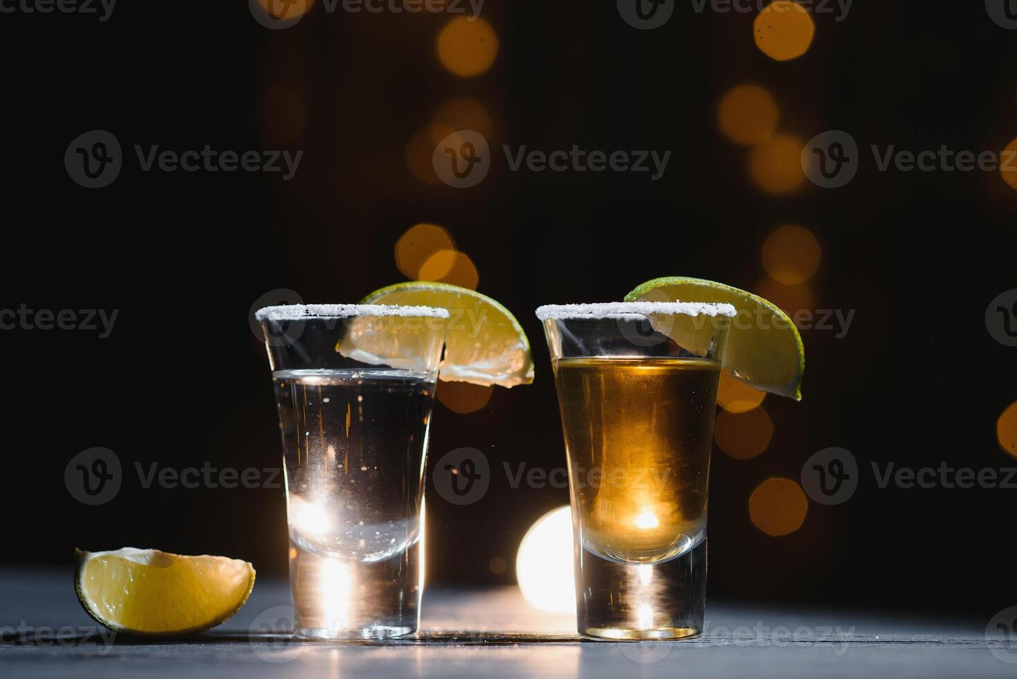 Mexican tequila with lime and salt on rustic wood background. space for text. concept luxury drink. Alcoholic drink concept. photo