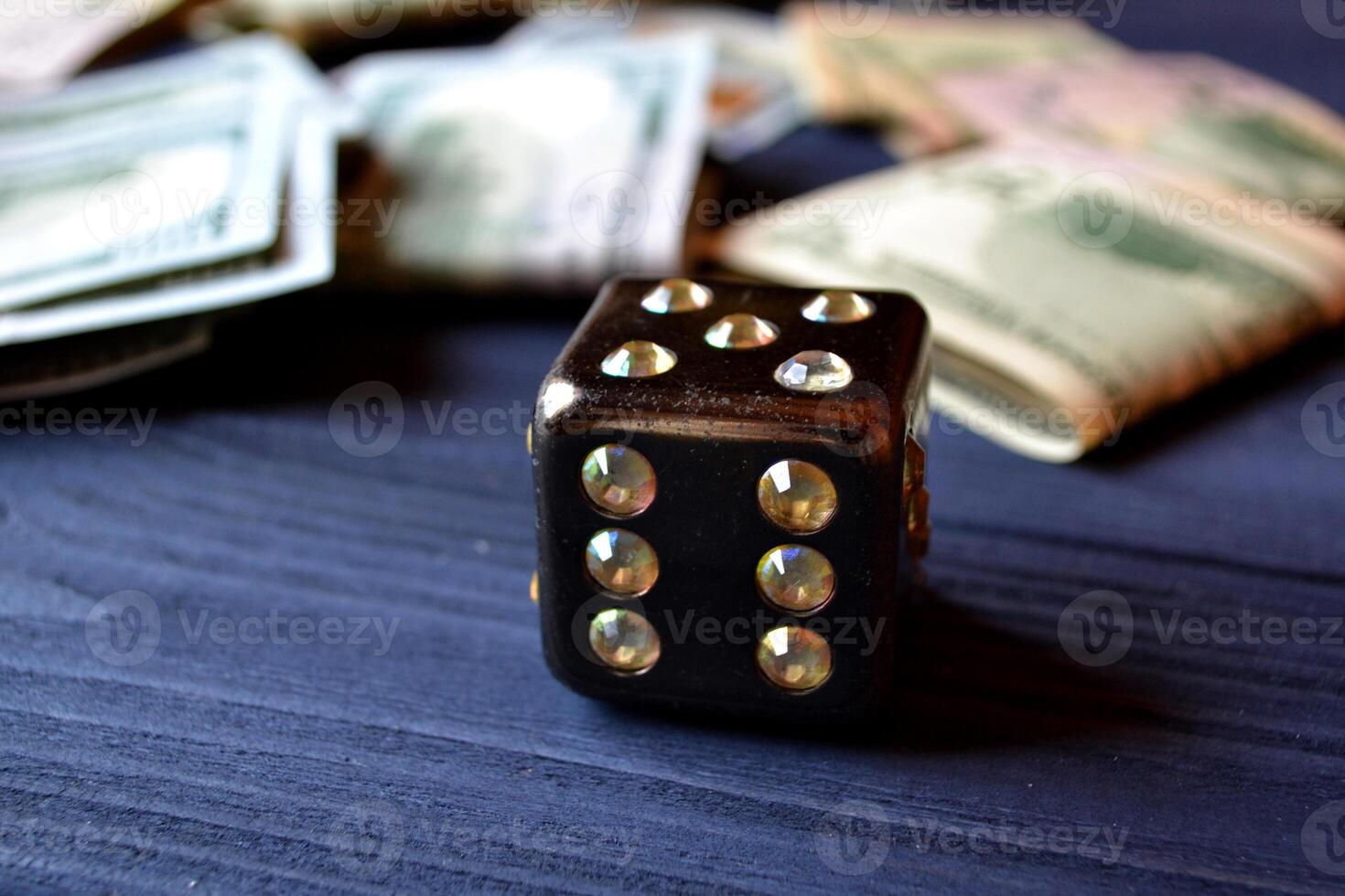 Dice cube with precious jewels on the table and money. Plaing cube. Games of chance. photo